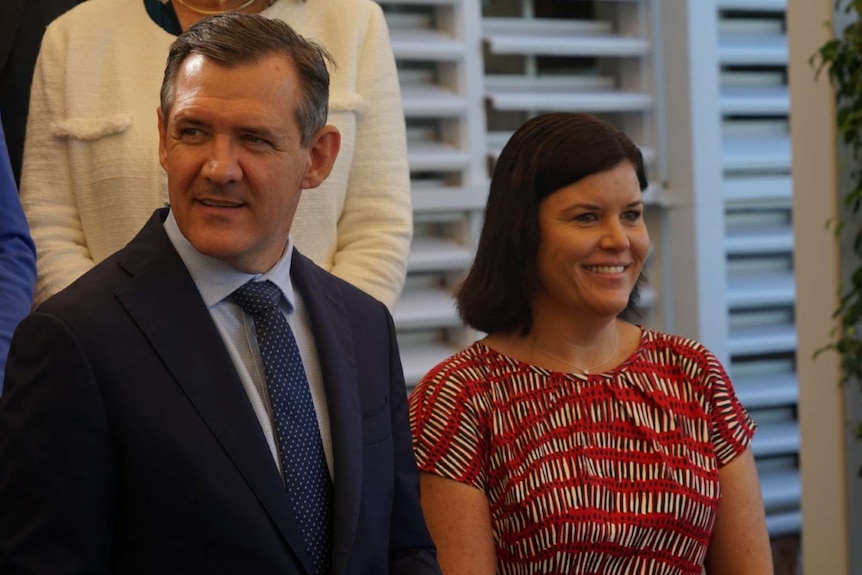 NT Chief Minister Michael Gunner and Health Minister Natasha Fyles pose for a photo outside Government House.