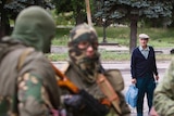 Man looks at Russian separatists in eastern Ukraine