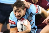 Cameron Murray runs while being tackled by Ben Hunt