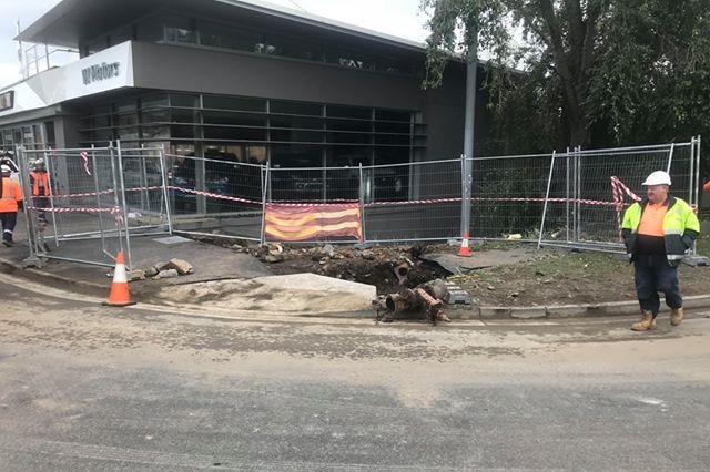 A hole in the ground beside the Brooker Highway where was water main burst.