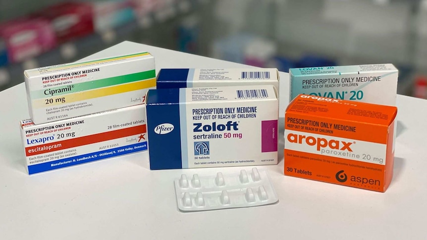 boxes of tablets on a pharmacy bench top