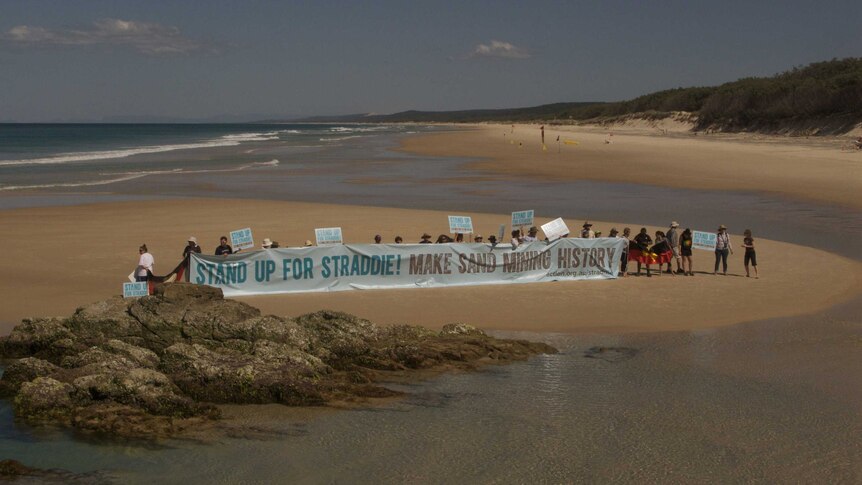 North Stradbroke Island residents gather today to call for an end to sand mining on the island.