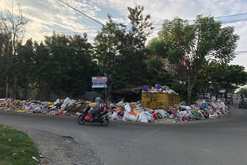 Garbage piles up in the streets of Palu in the wake of the earthquake and tsunami that struck the region.