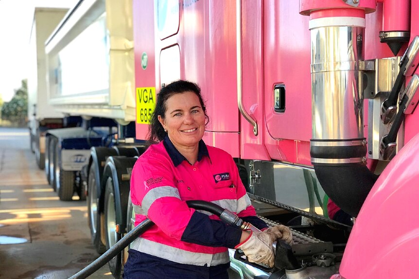 Truck driver Heather Jones refills her road train at Roebuck Plains Roadhouse in the Kimberley