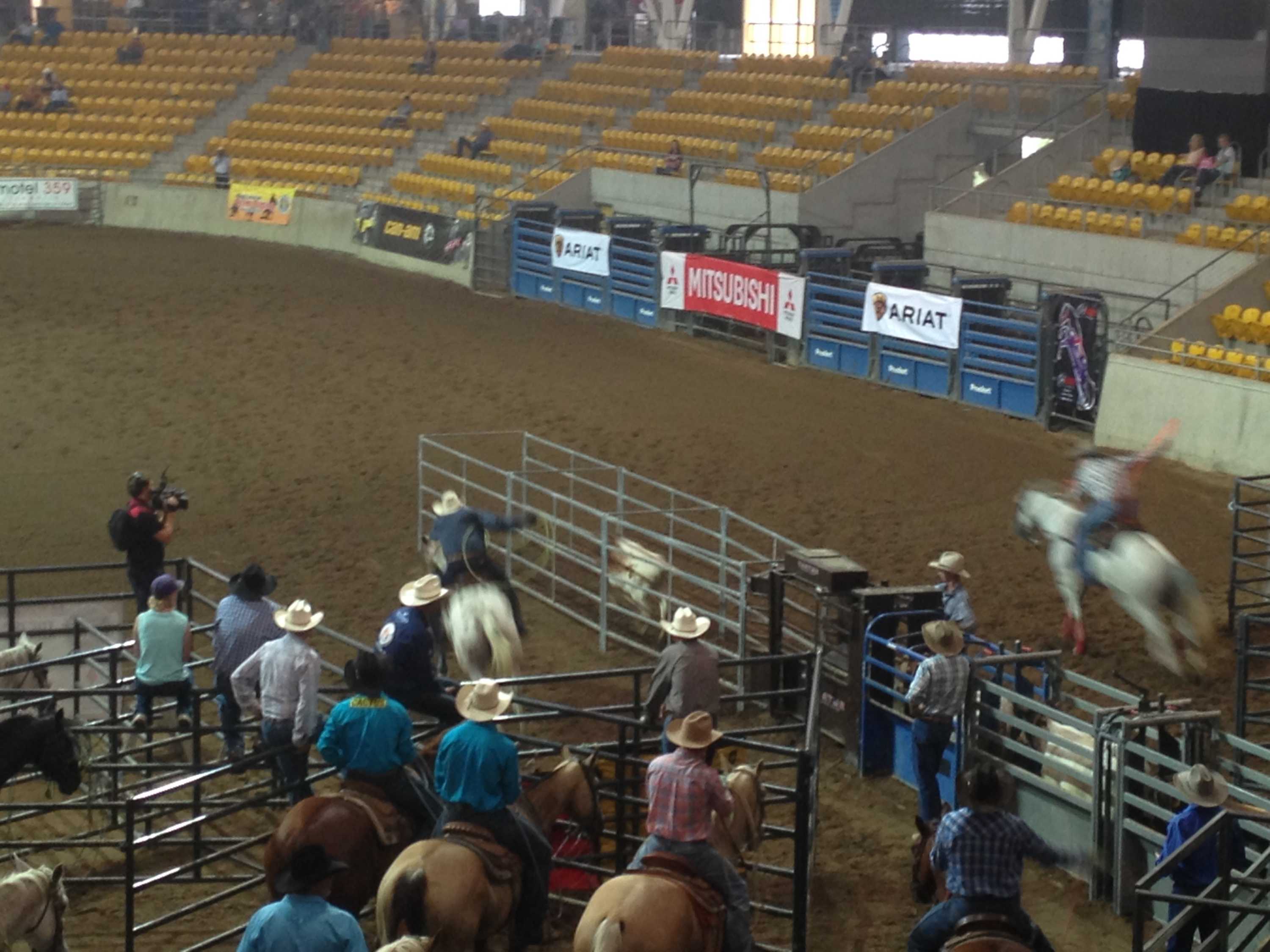 Teen takes home two new cars at team roping championships - ABC News
