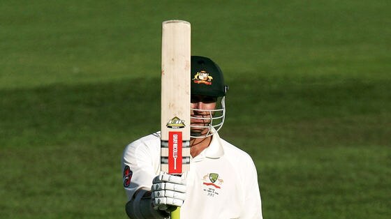 Phil Jaques raises his bat after posting a half-century on day three of the second Test