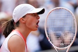  Iga Świątek celebrates winning a point during 2024 French Open final.