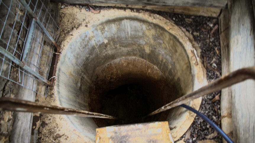 Looking down a shaft leading into a gem mine in Rubyvale
