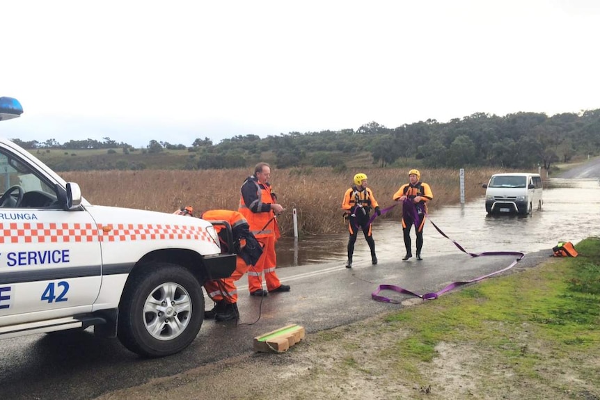 Van stalled in floodwaters across Winery Road