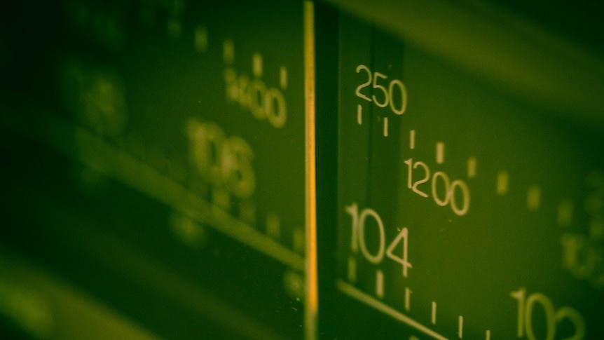 Closeup of a radio tuning dial.