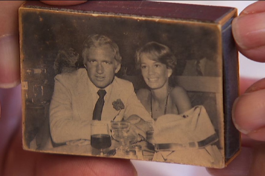 A matchbox showing a old photo of Lady Susan Renouf with Andrew Peacock