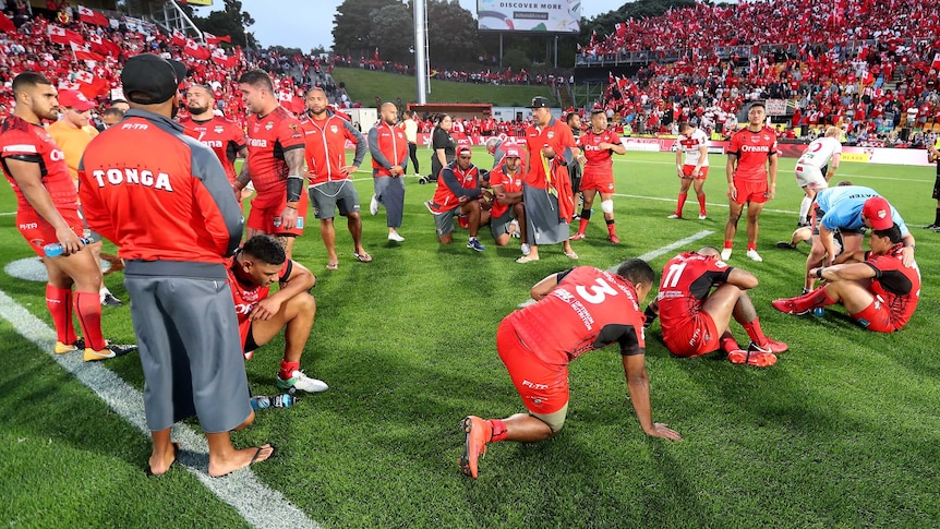 Dejected Tonga players after losing the Rugby League World Cup semi final to England.