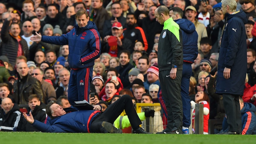 Louis van Gaal falls to the ground