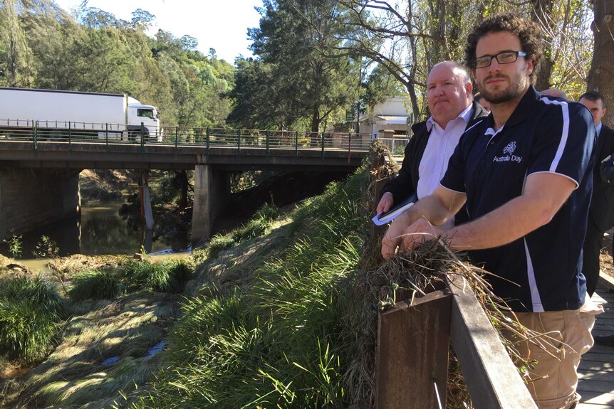 State Disaster Recovery Coordinator Dave Owens with Wollondilly Mayor Simon Landow survey the damage at Stonequarry Creek.