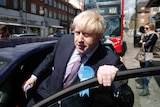 Boris Johnson leaves Golders Green by car, he is climbing into the car.