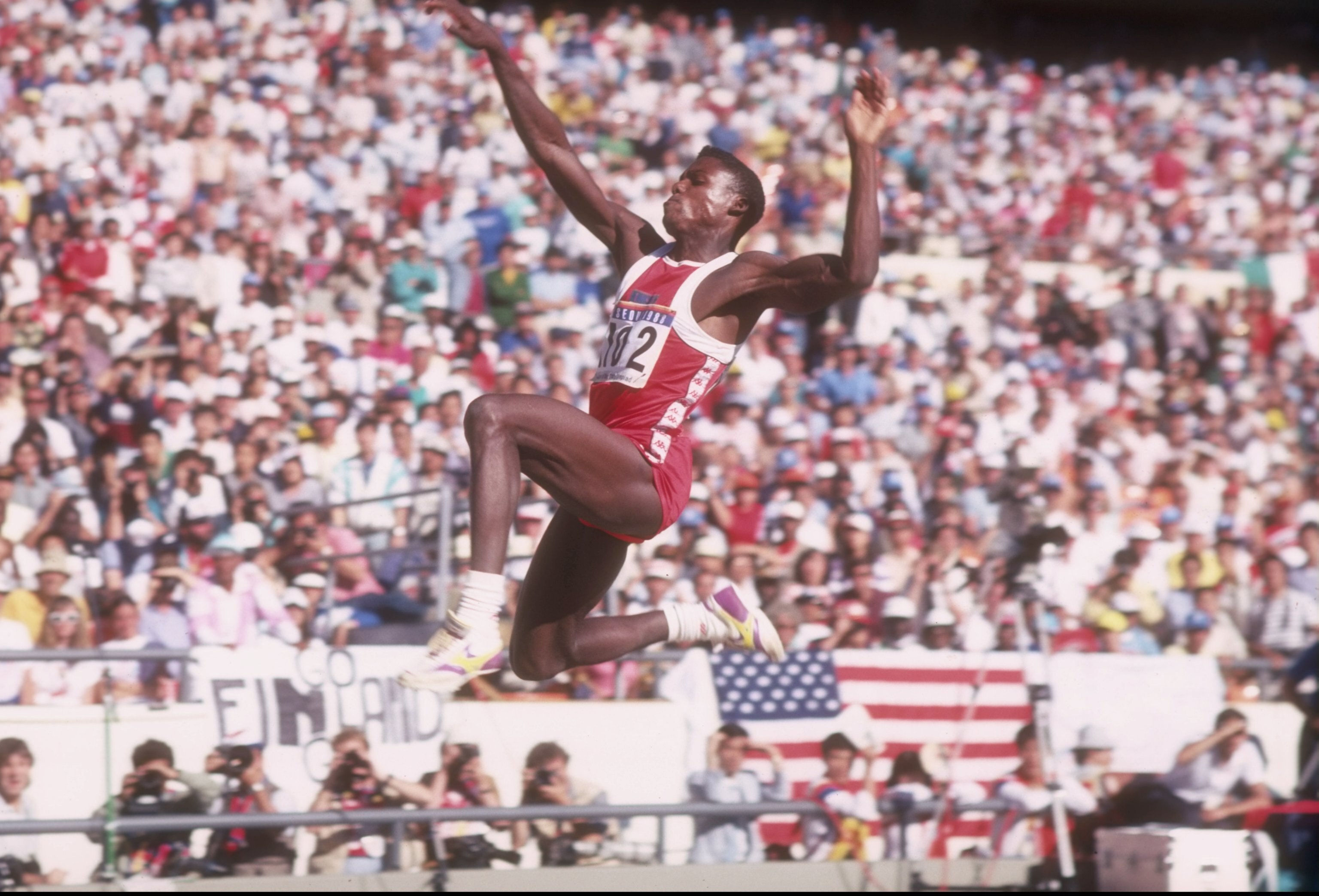 Carl Lewis competing in the long jump at 1988 Olympics.