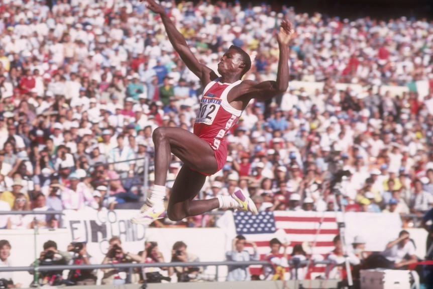 Carl Lewis competing in the long jump at 1988 Olympics.