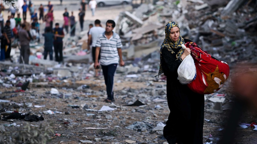 Woman walking in Gaza