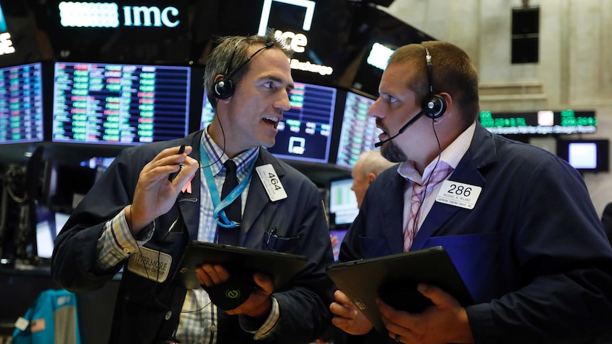 Traders on the floor of Wall Street.