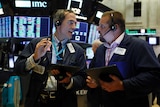 Traders on the floor of Wall Street