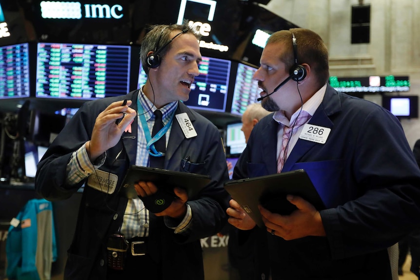 traders on the floor of Wall Street