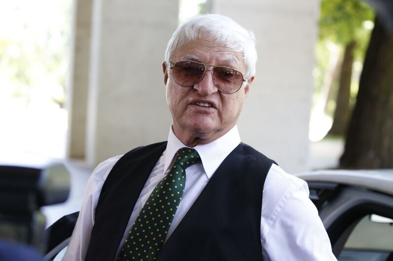 Member for Kennedy Bob Katter, stepping out of a car