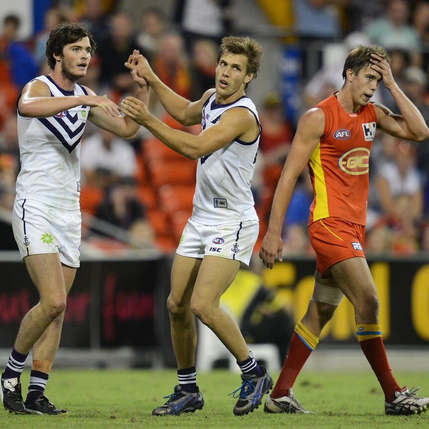 Dockers celebrate a thrilling comeback win over the Gold Coast.