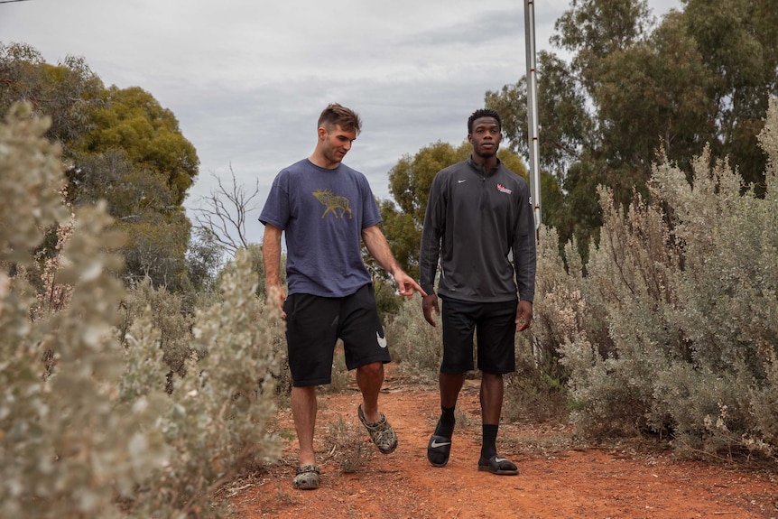 Goldfields Giants players Patrick Burke and Jay Bowie in bushland near their house in Kalgoorlie, WA.