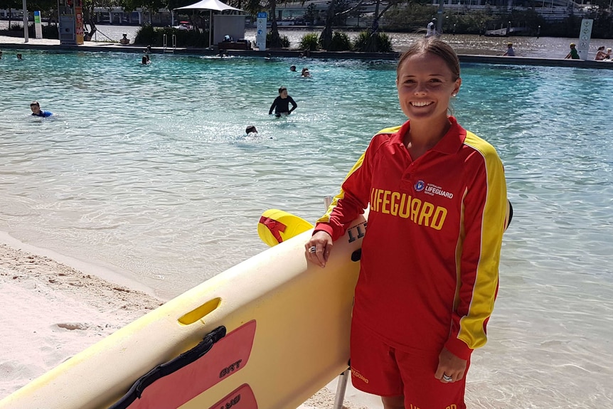 Kimberley Base stands on the sand at South Bank, she suggests meeting new people at work is a way to maintain job satisfaction.