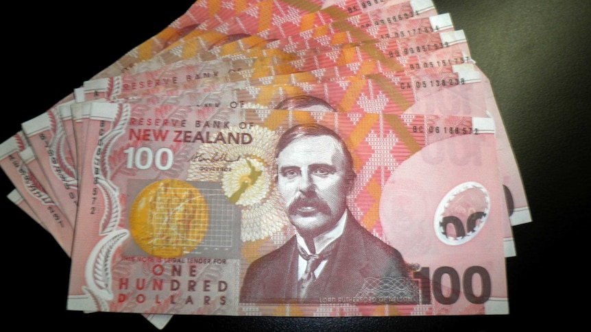 New Zealand currency sits on a table