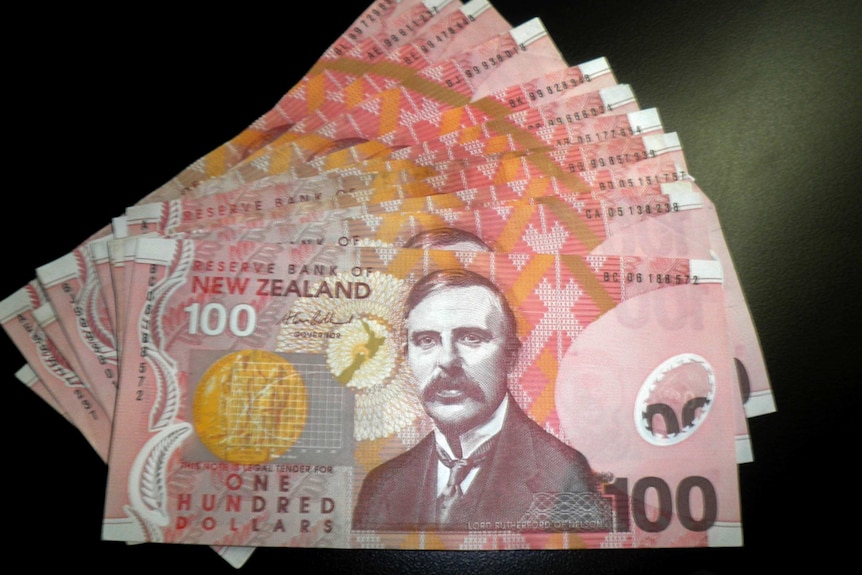 New Zealand currency sits on a table
