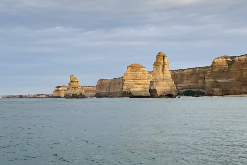 Limestone pillars rise from Southern Ocean.