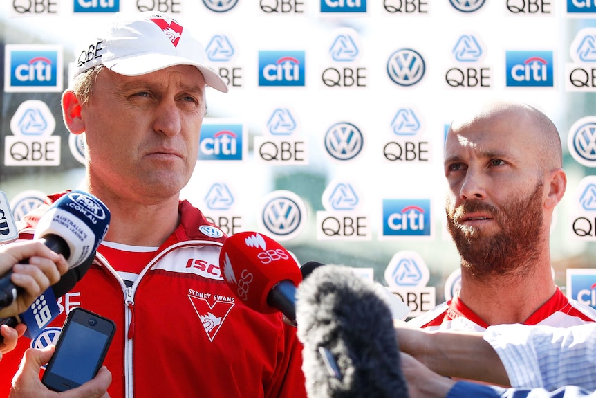 Swans coach John Longmire and co-captain Jarrad McVeigh speak to the media on September 8, 2015.