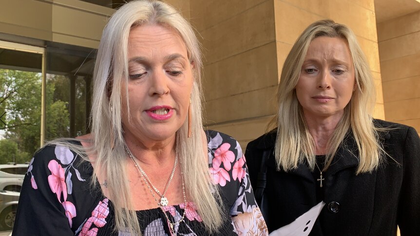 Kylie McWilliams standing next to a blonde woman outside court