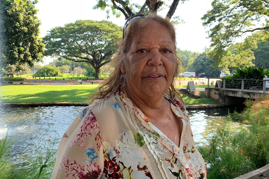 Linda Turner stands by a small pond.