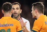 Two Wallabies players speak to the referee during the Bledisloe Cup Test.