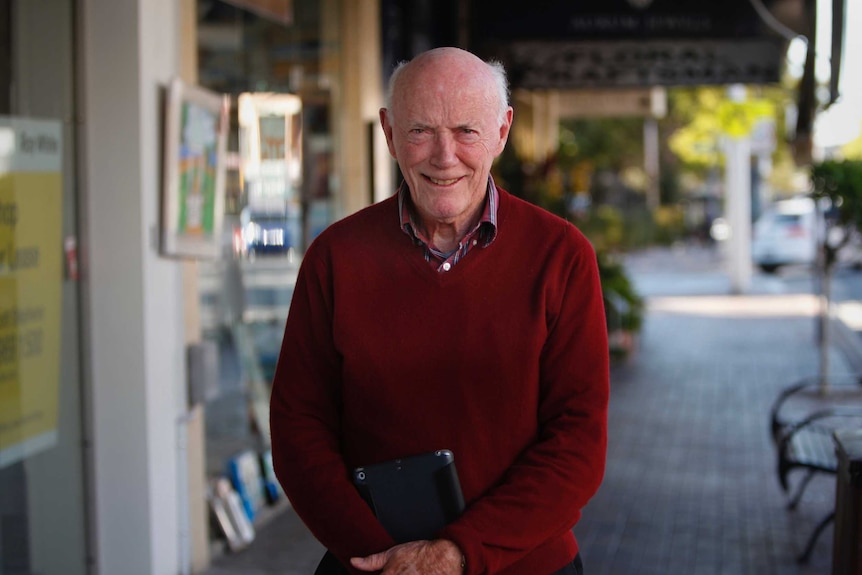 A man standing on a street.