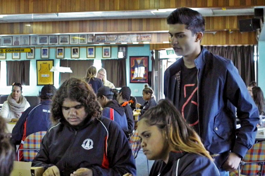 Taj Pabari with students.