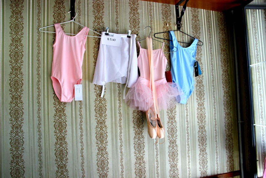 Ballet clothes hanging on the wall in Salvios