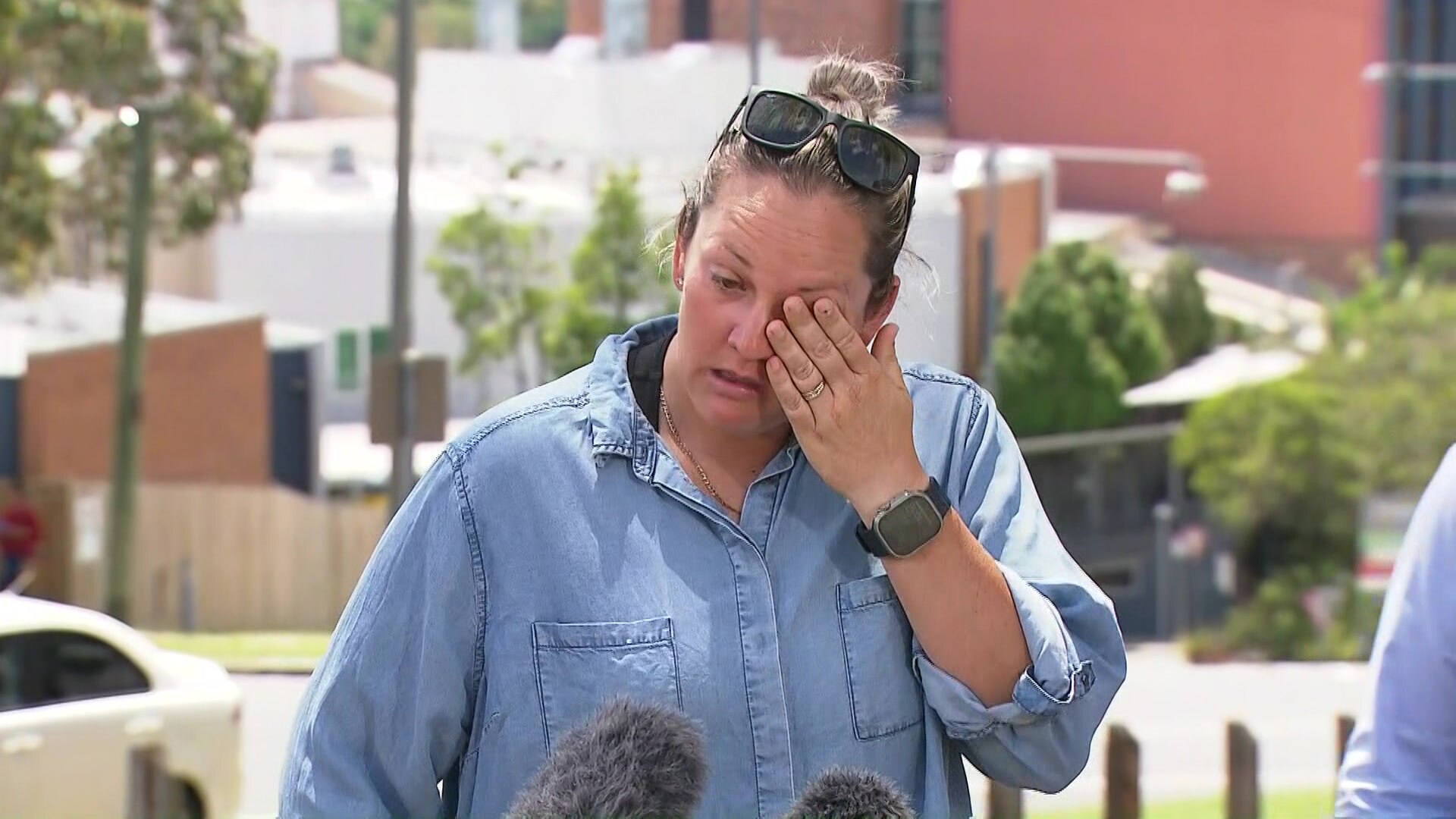 Lauren Hansford wiping away tears