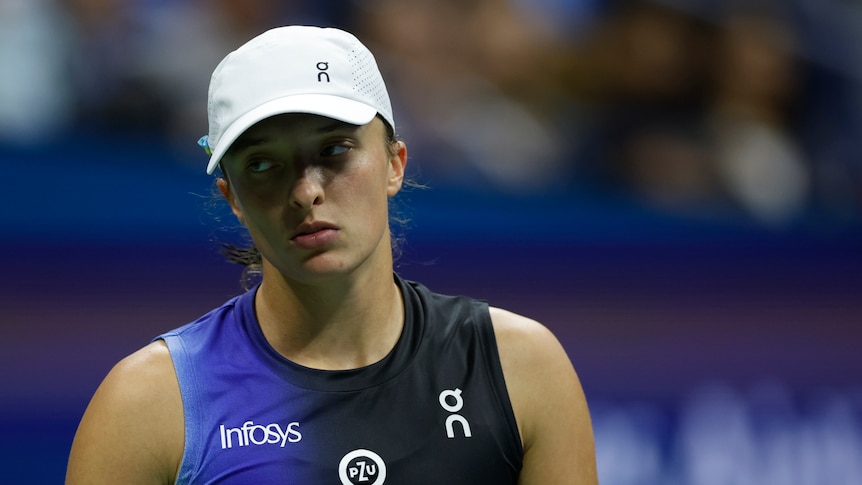A Polish women's tennis player looks dejected after losing a point in a match at the US Open.