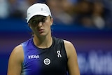 A Polish women's tennis player looks dejected after losing a point in a match at the US Open.