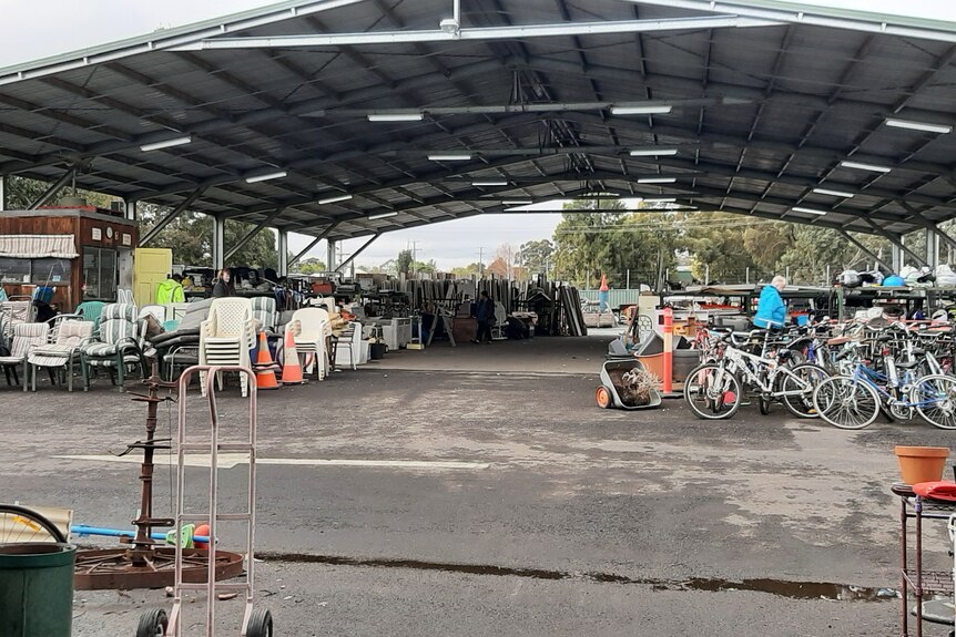 A wide photo showing the many goods for sale at Eaglehawk Recycle Shop, including chairs, bikes and more.