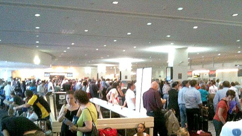 Pasengers waited around in the Virgin terminal at Melbourne Airport yesterday.