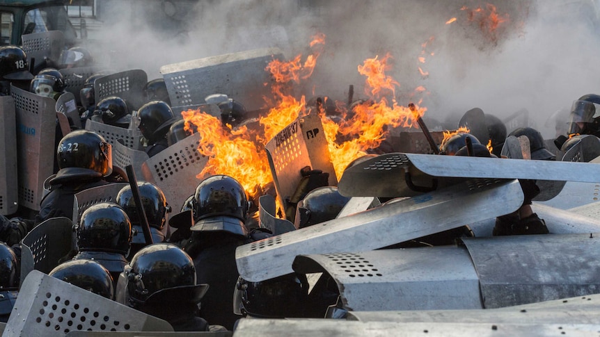 Riot police clash violently with protesters in Kiev, Ukraine.