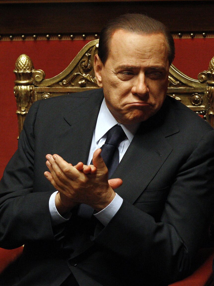 Silvio Berlusconi claps during a session at the Senate