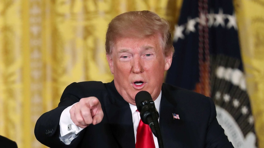 US President Donald Trump hosts a meeting of the National Space Council in the East Room of the White House.