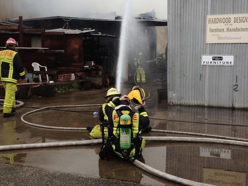 Fire crews attend at the scene of a furniture factory fire in Rich Street, Marrickville.