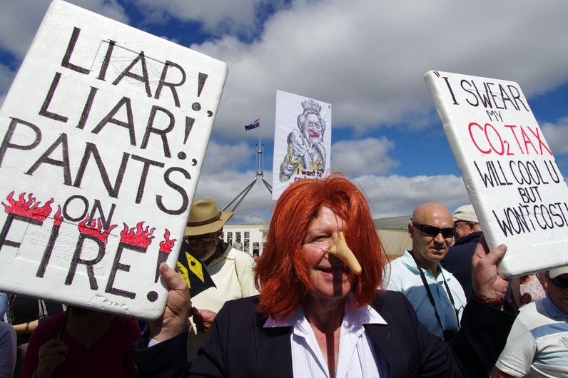 A protester wearing a Julia Gillard wig and fake nose at an anti-carbon tax rally in Canberra on March 23, 2011.