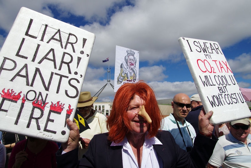 A protester wearing a Julia Gillard wig and fake nose at an anti-carbon tax rally in Canberra
